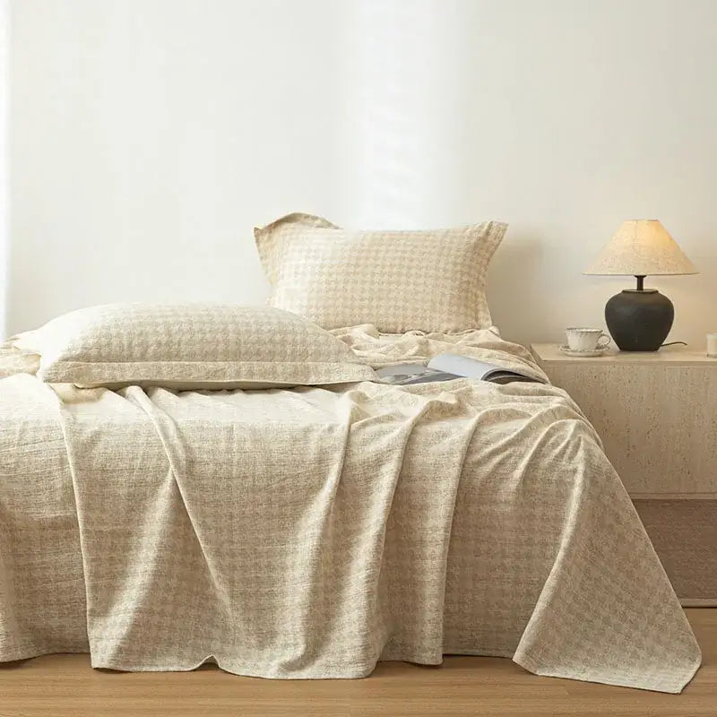 Beige fern leaf cotton linen bed sheet set featuring a textured bedspread with a subtle woven pattern for bedroom use