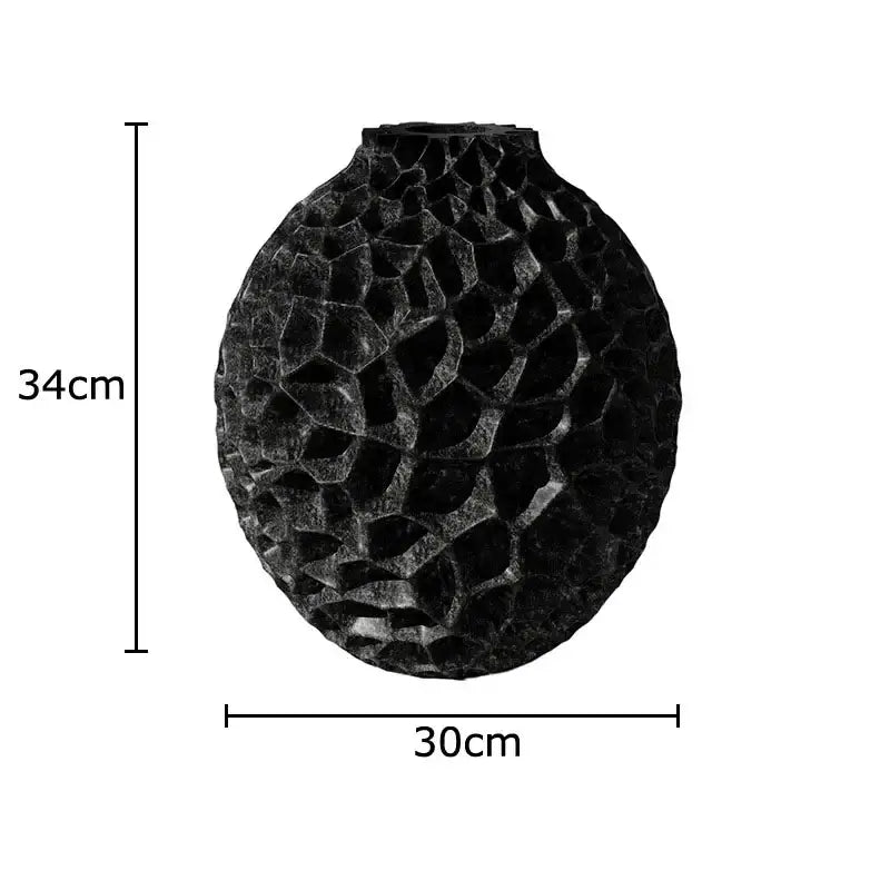 Black honeycomb texture ceramic vase with rounded surface perfect for artificial flower arrangement in living room