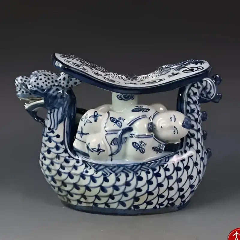 Blue and white porcelain dragon boat statue with intricate patterns for bedroom decor