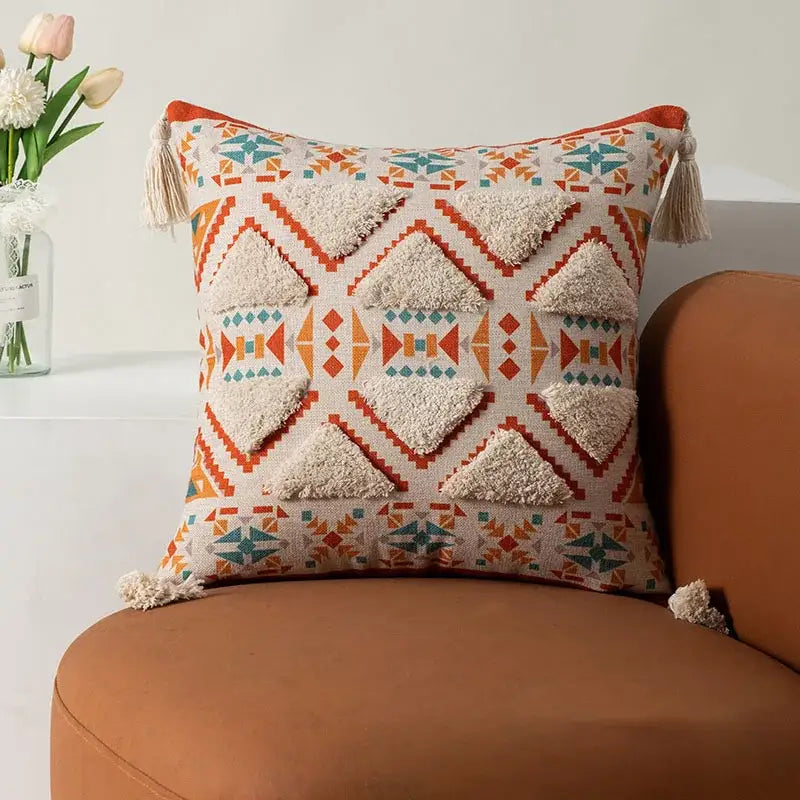 Cream-colored bohemian floral throw pillow cover with orange and teal geometric appliqués and tassels for living room decorbites bohemian floral