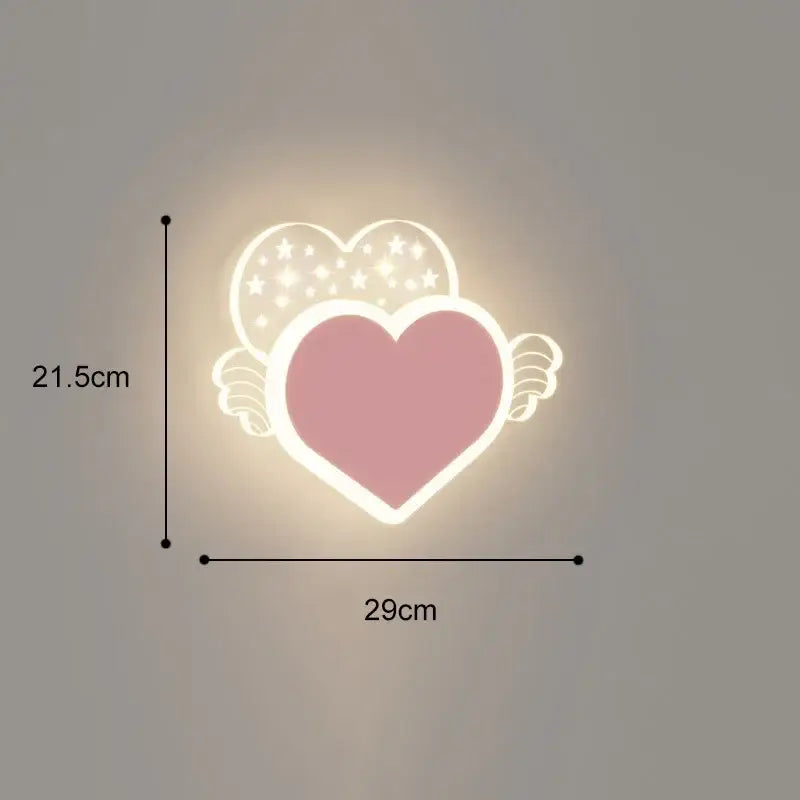 Pink heart-shaped cartoon wall lamp with white glowing outline and star-patterned wings for bedroom decor