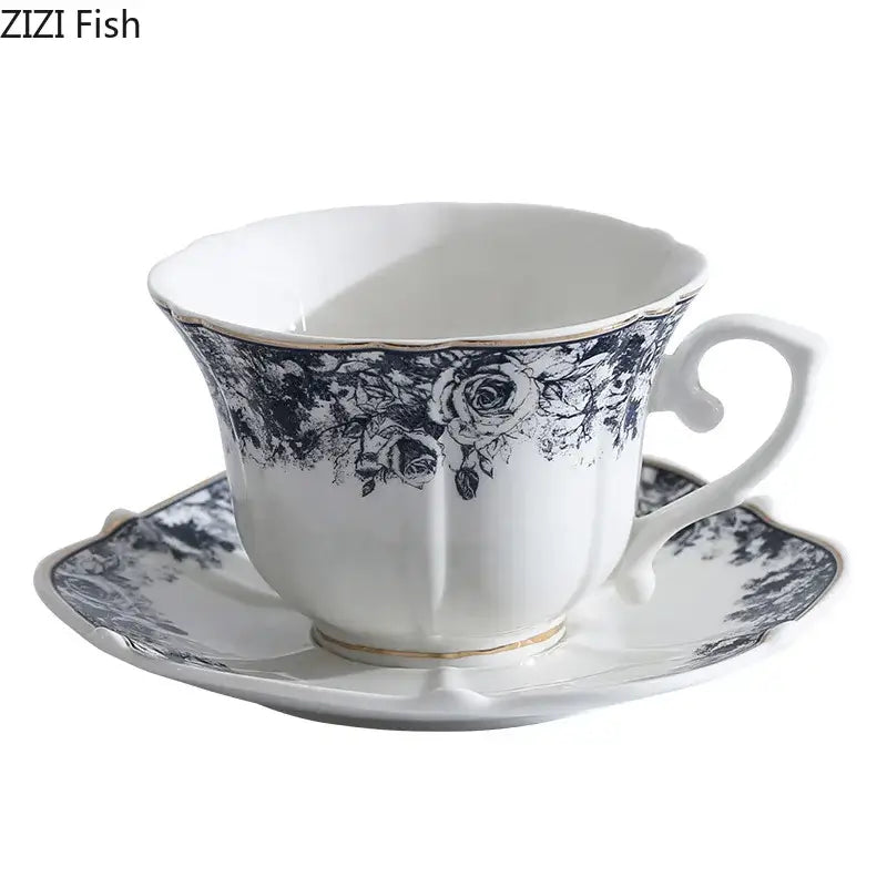 Elegant white ceramic cup and saucer set with grey blue rose floral pattern and gold trim for dining room use