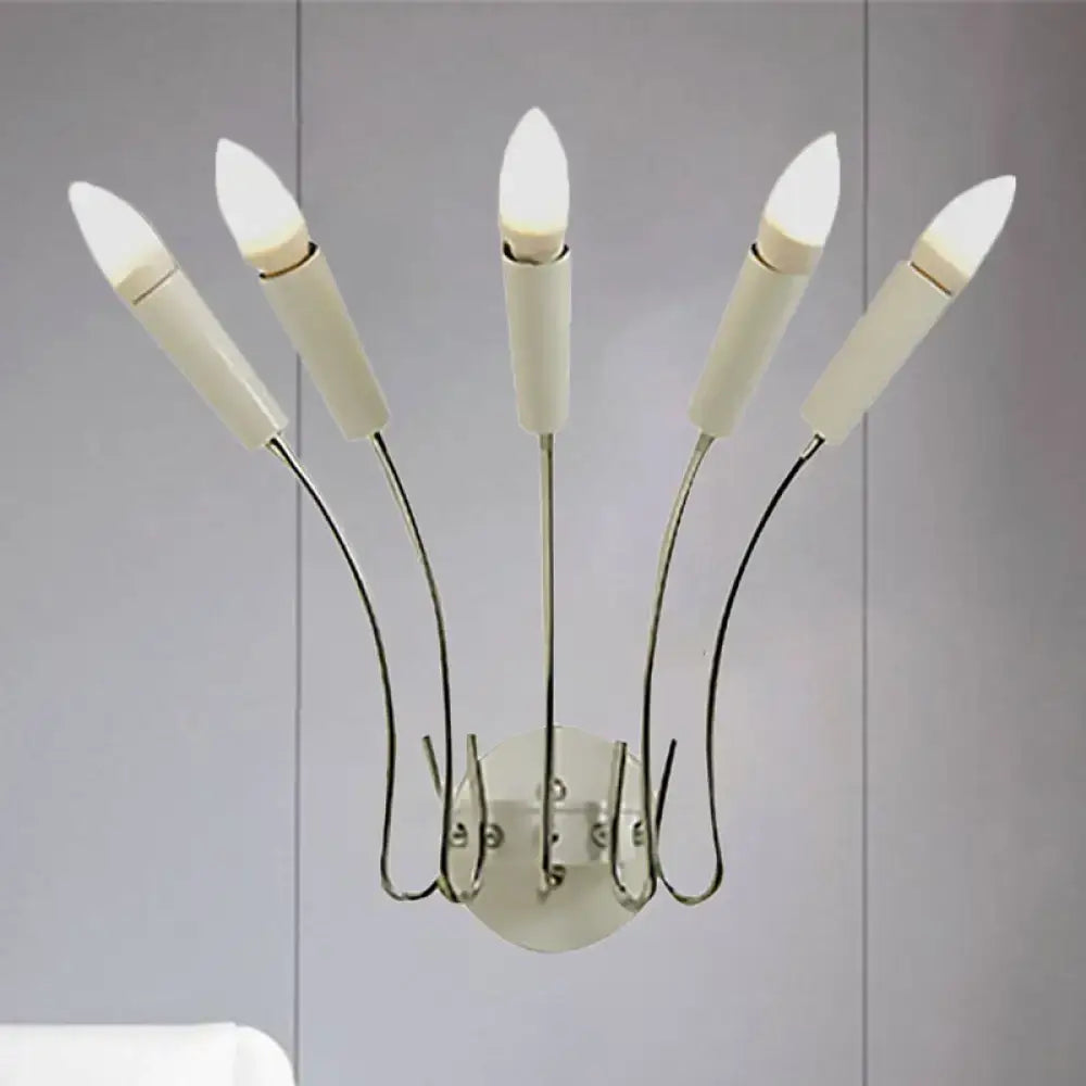 Modern five-light contemporary metal sconce with curved chrome arms and frosted candle-style bulbs for living room
