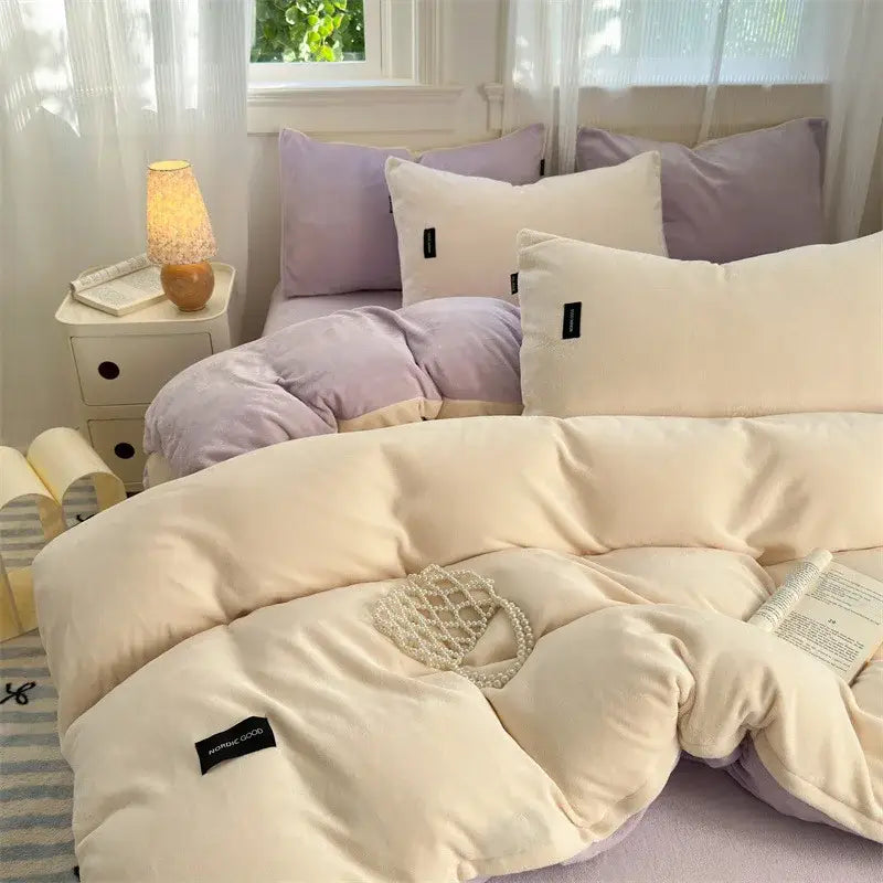 Cream-colored plush velvet duvet cover from decorbites coral color blocked set with lavender pillows and black brand tags