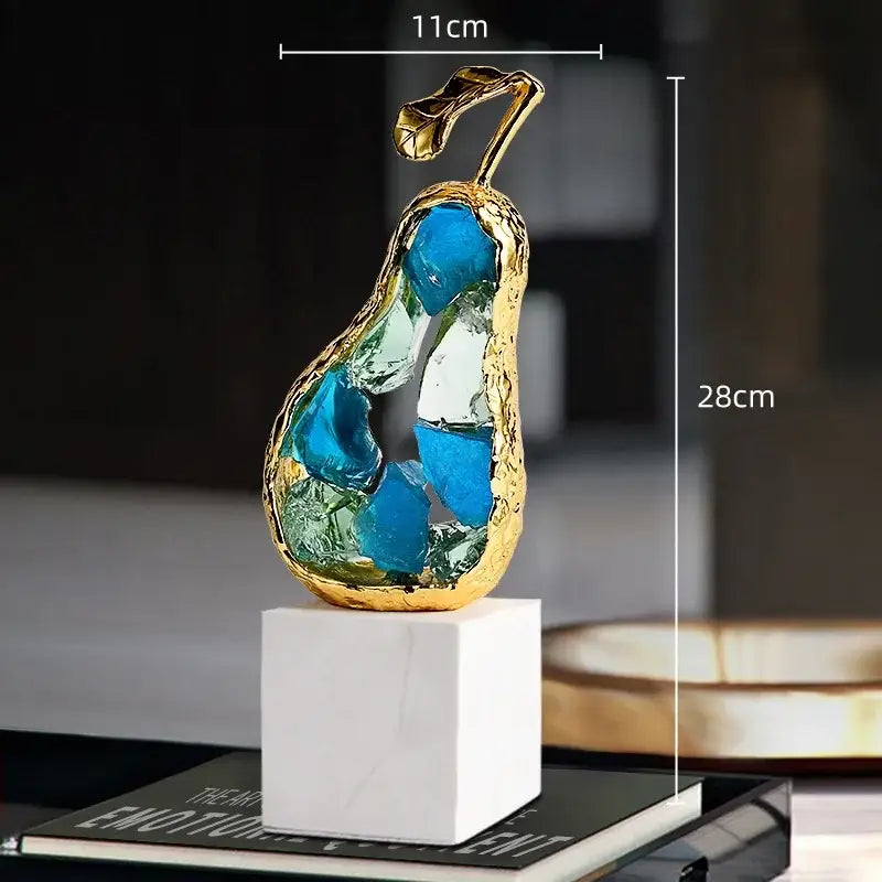 Gold-framed crystal fruit sculpture with blue and green glass shards on white marble base for living room decorbites crystal fruit