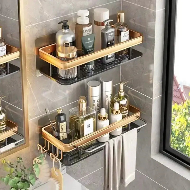 Gold and black DecorBites™ aluminum corner bathroom shelf with double tiers and towel hooks for organized storage