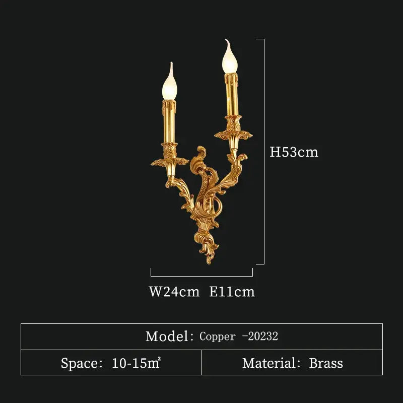 Gold-colored brass wall sconce with ornate curved design and two candle-style lights antique brass wall lighting