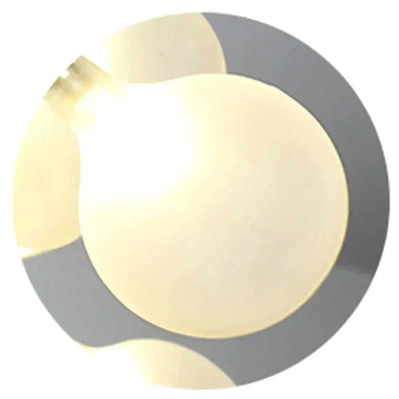 A glowing translucent yellow led bulb with matte finish and metallic base in decorbites black gold tree branch chandelier
