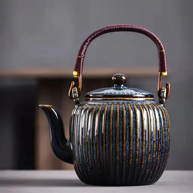 Decorbites™ chinese ceramic teapot set with glossy dark blue glaze, gold stripes, woven purple handle, and brass accents
