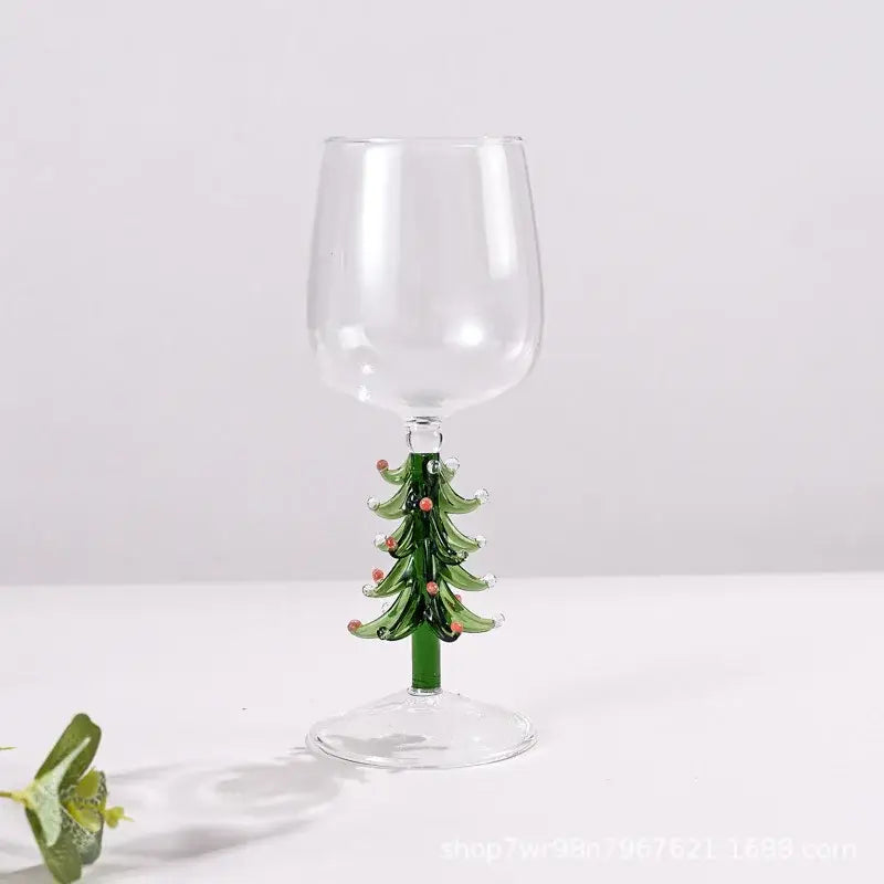 Clear glass goblet with green christmas tree stem and red ornaments from decorbites glass goblet set for festive use