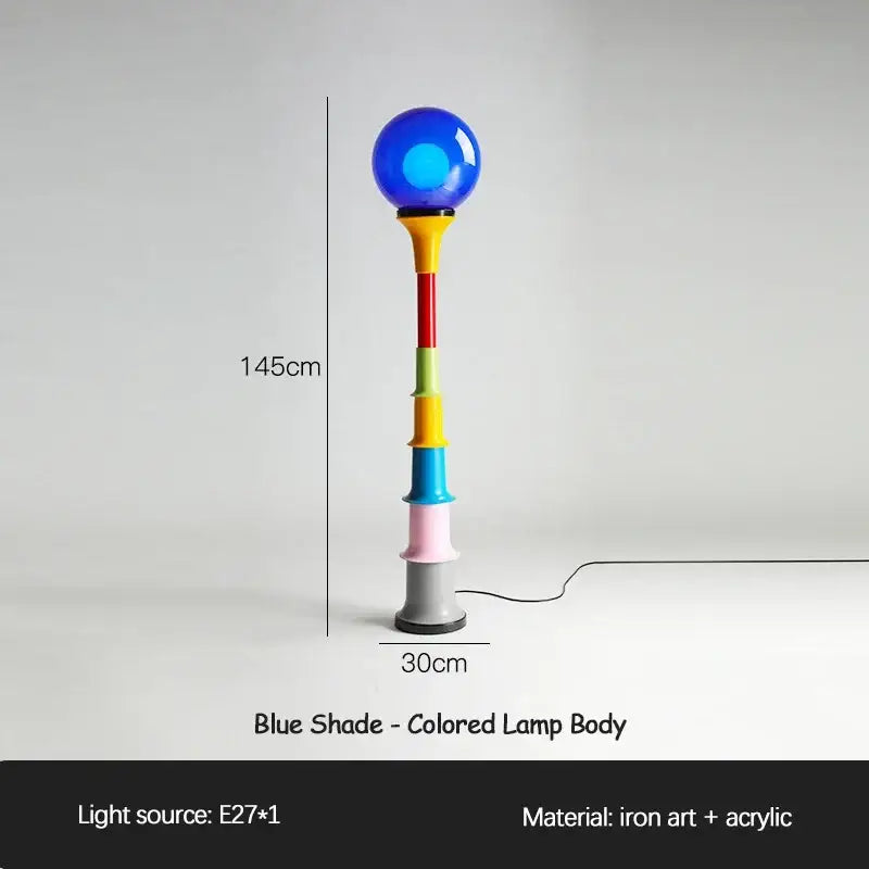 A vibrant 145cm decorbites colorful memphis floor lamp with a glossy blue spherical shade and acrylic stacked segments