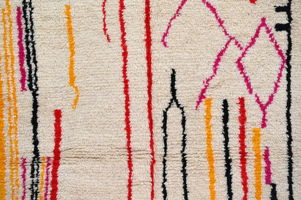 Cream-colored handmade traditional azilal rug with vibrant red, black, yellow, and pink vertical stripes 253x144 cm