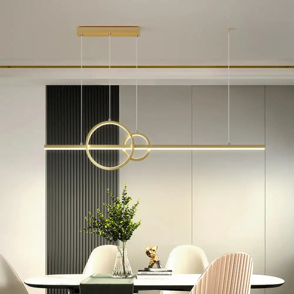 Modern gold-toned decorbites led circle and line suspension lamp with sleek rings and warm white third gear lighting