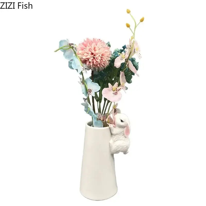 White ceramic vase with a sculpted bunny and pastel floral arrangement decorbites lovely rabbit ceramic vase pot