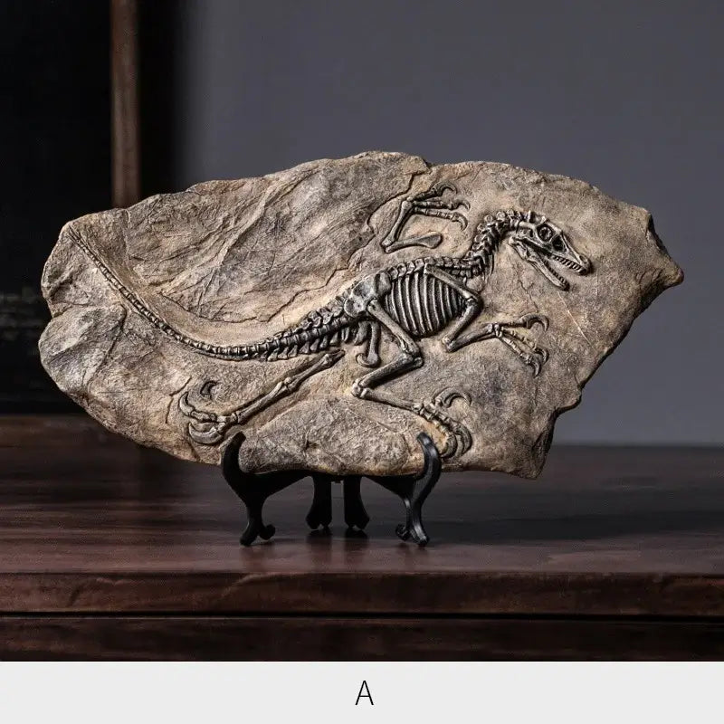 Grayish brown decorbites dinosaur fossil resin craft sculpture featuring a detailed fossil embedded in textured rock slab