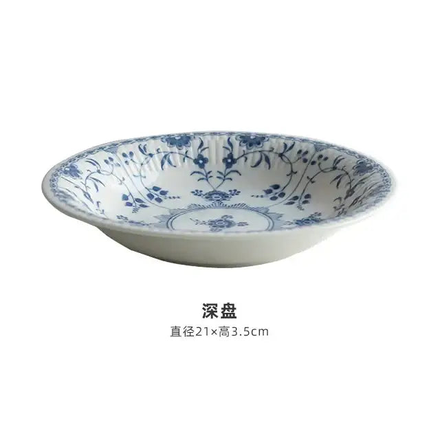 White ceramic deep dish with intricate blue floral vine patterns for elegant ceramic dining set use