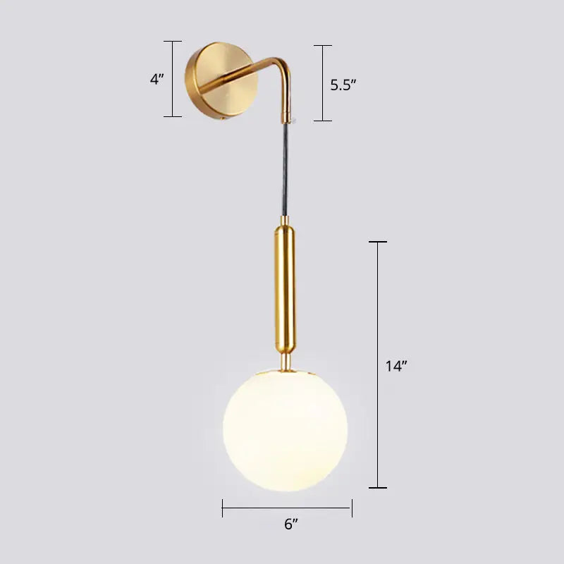 Gold finished glass spherical wall light fixture with opal glass spherical shade and brass accent for bedroom use
