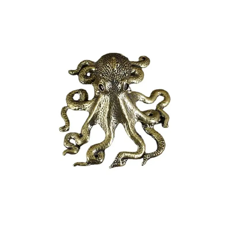 Antique brass octopus sculpture with detailed texture and dark gemstone eyes for living room decorbites brass octopus decor