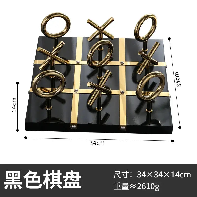 Black glossy tic-tac-toe board with gold metal xs and os in decorbites golden chessboard metal handicraft design