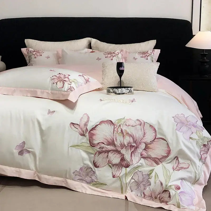 Elegant ivory satin duvet cover with blooming flowers embroidery and subtle butterfly motifs in decorbites bedding set
