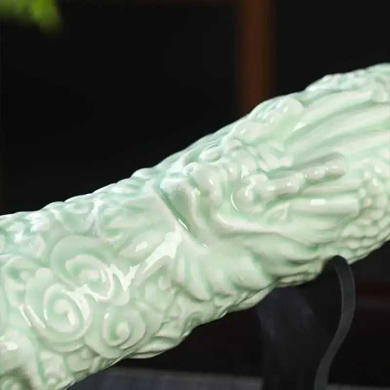 Jade green and gold ceramic wine bottles with a delicate pale green dragon handle featuring intricate cloud patterns