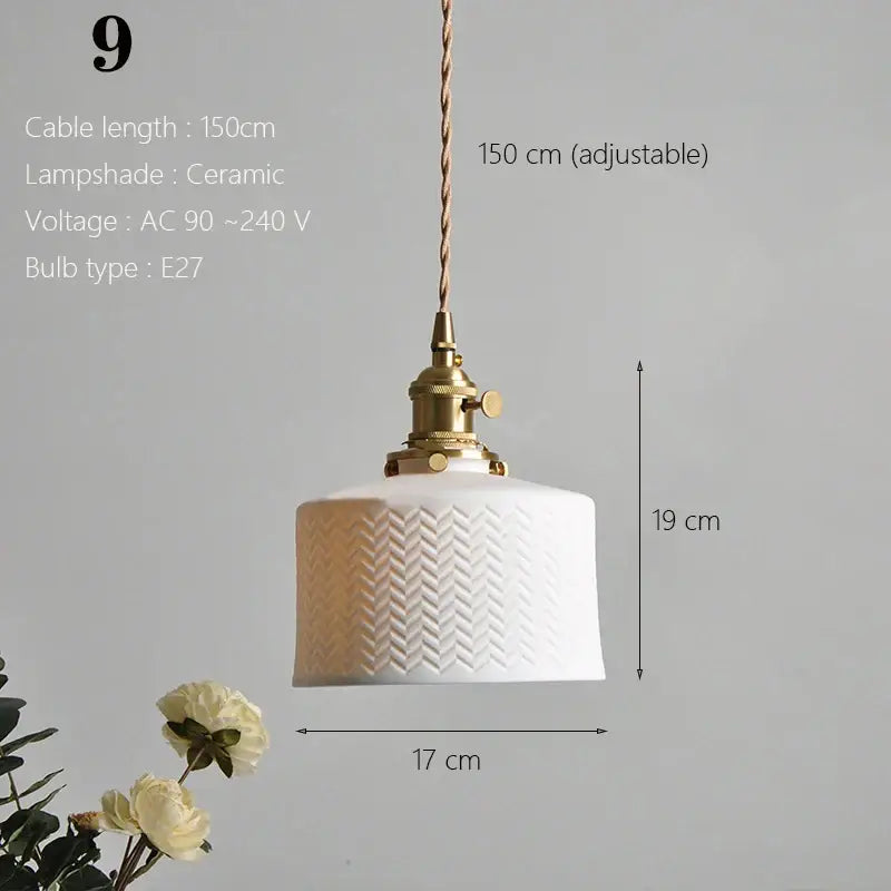 White ceramic pendant light with textured herringbone pattern and brass hardware for kitchen or dining room use