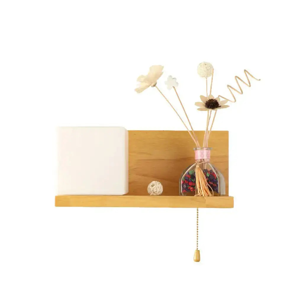 Lightweight wooden wall light with milk glass cube and minimalist shelf featuring glass diffuser and dried flowers