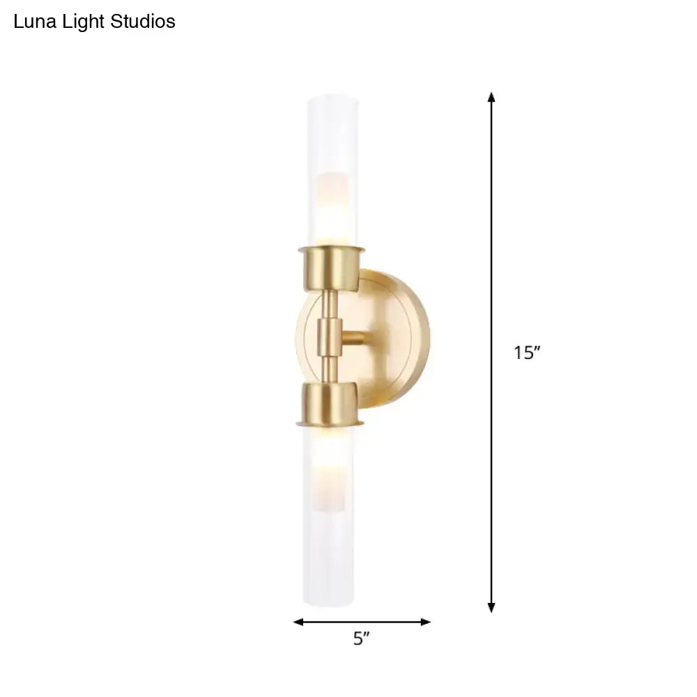 Minimalist gold double cylinder wall sconce 15 inch fixture with brushed brass finish and frosted glass cylinders for bedroom
