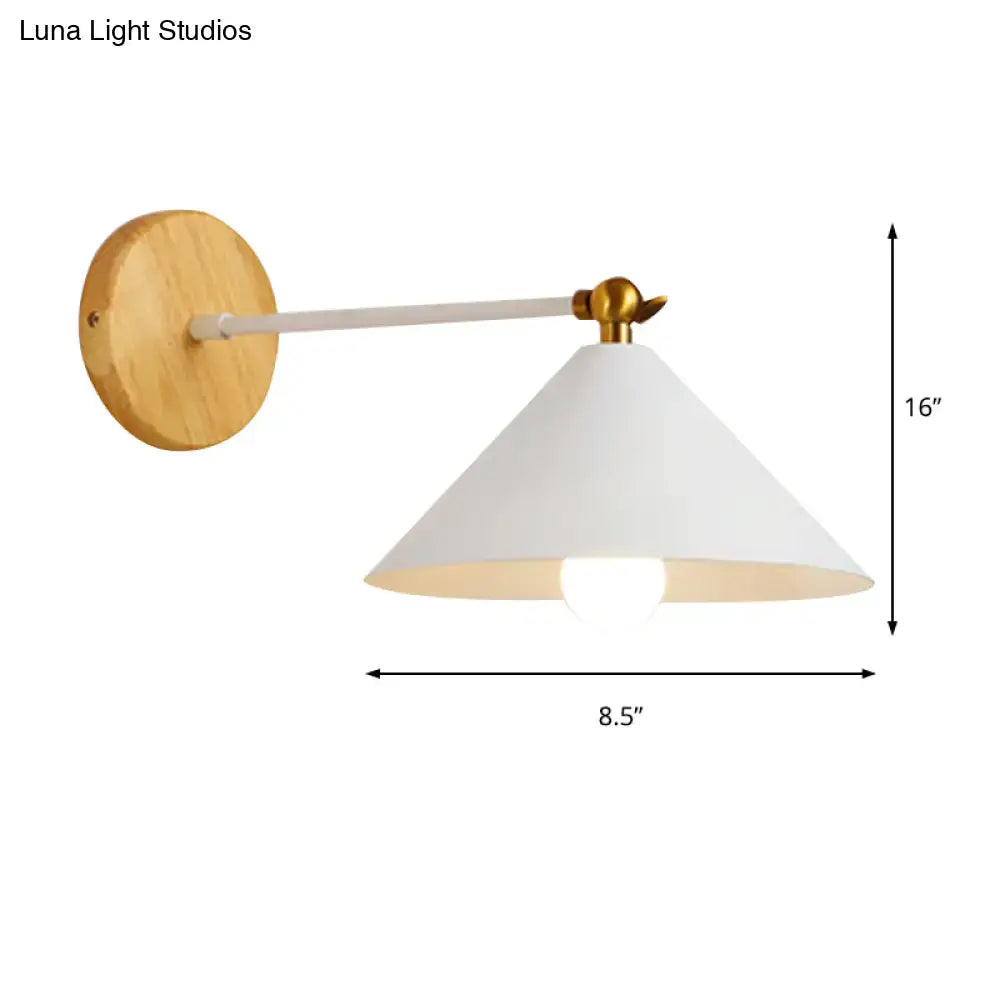 Minimalist white and brass pyramid wall lighting with conical shade and natural wood circular backplate for bedroom use