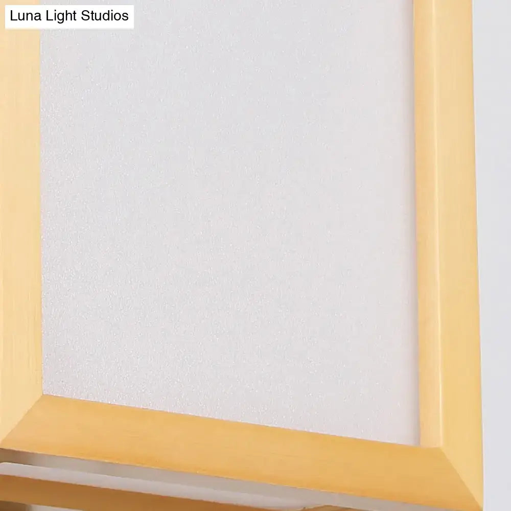 Minimalist wall sconce with white glass and a light yellow wooden frame designed for corridor lighting
