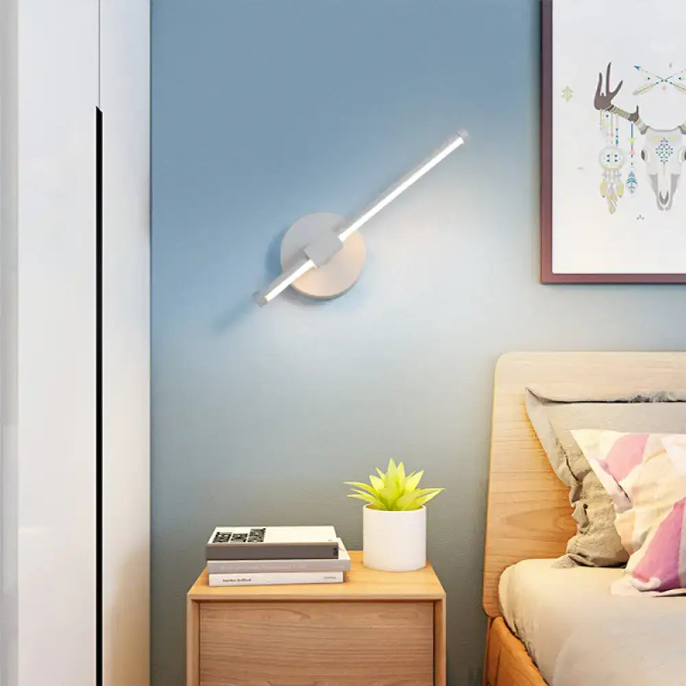 Modern minimalist white metallic wall sconce with angled linear light bar for bedroom wall mount lighting maximum bulb wattage