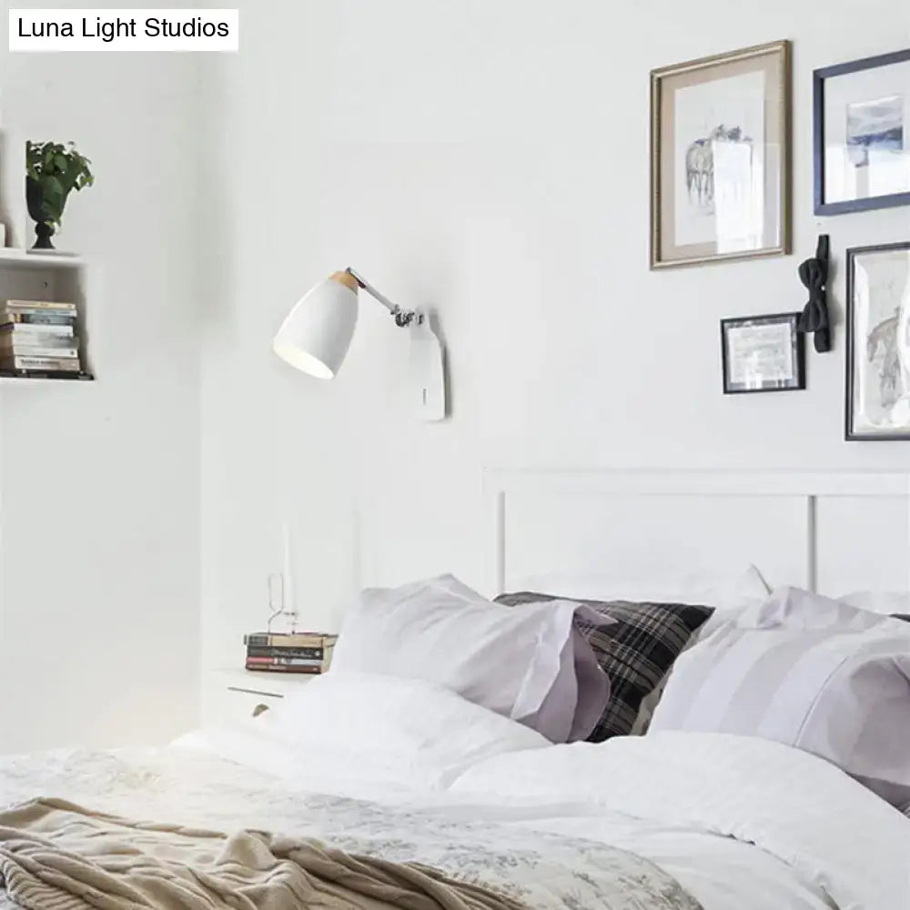 Minimalist white tapered wall light with wood accents mounted on wall as a study desk lamp