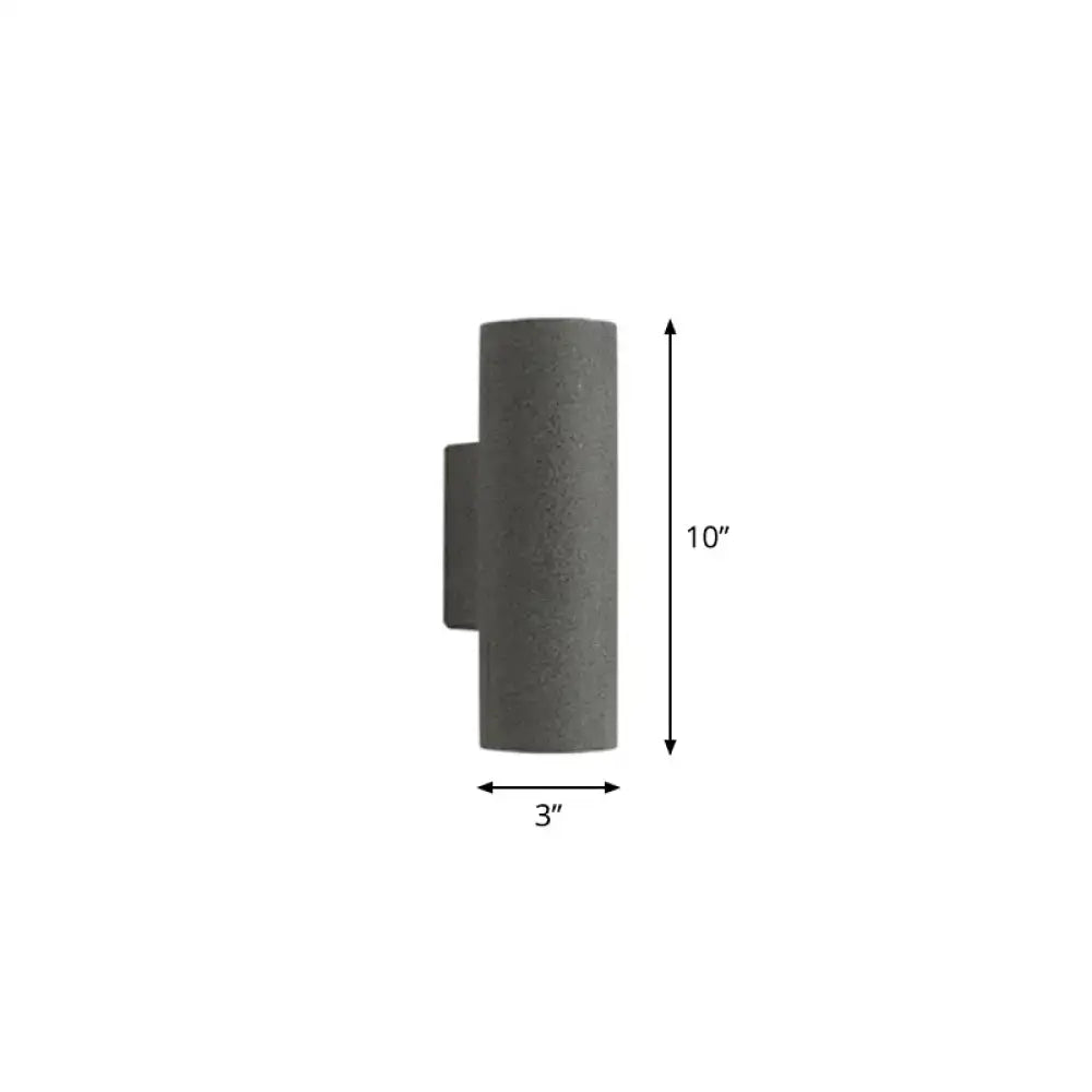 Gray concrete outdoor wall sconce with 10-inch fixture height and minimalist white terrazzo stair design