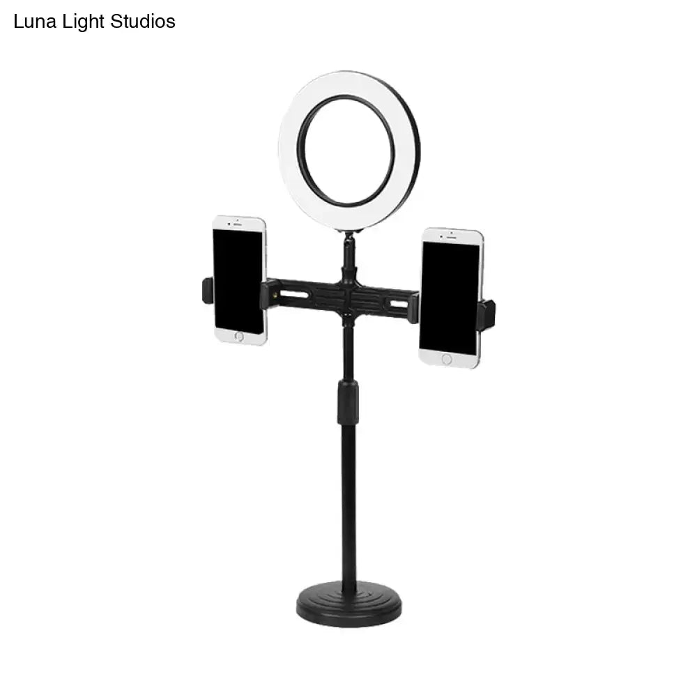 Modern black circle led wall light with usb port features an adjustable black stand, ring light, and two phone holders