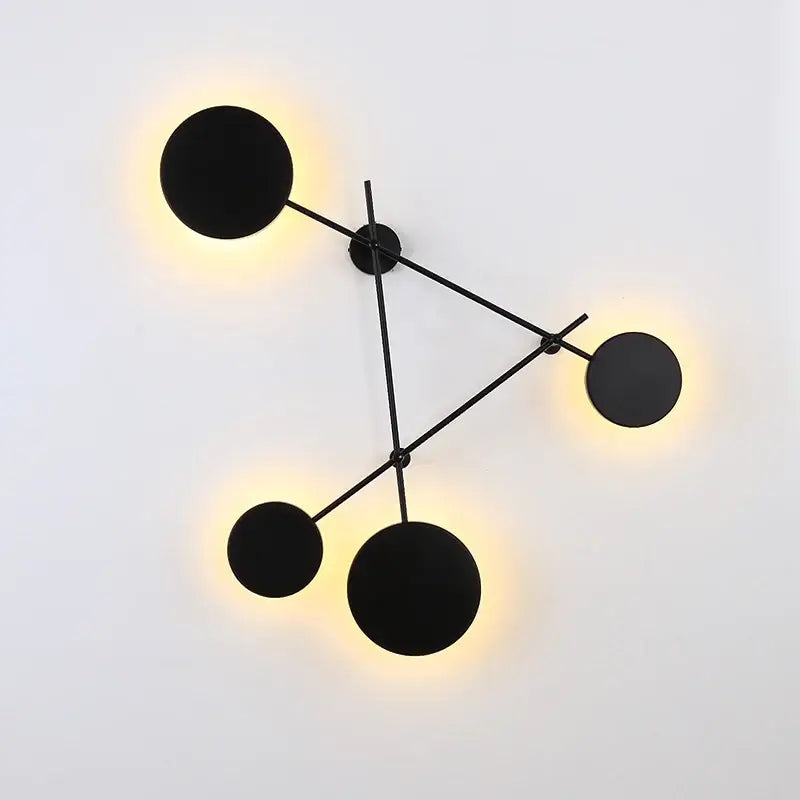 Modern black geometric iron wall lamp with glowing circular light fixtures for stylish living room decorbites geometric iron wall