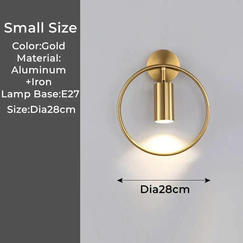 Gold-finished modern led wall lamp with circular ring and cylindrical head made of aluminum and iron for bedroom use