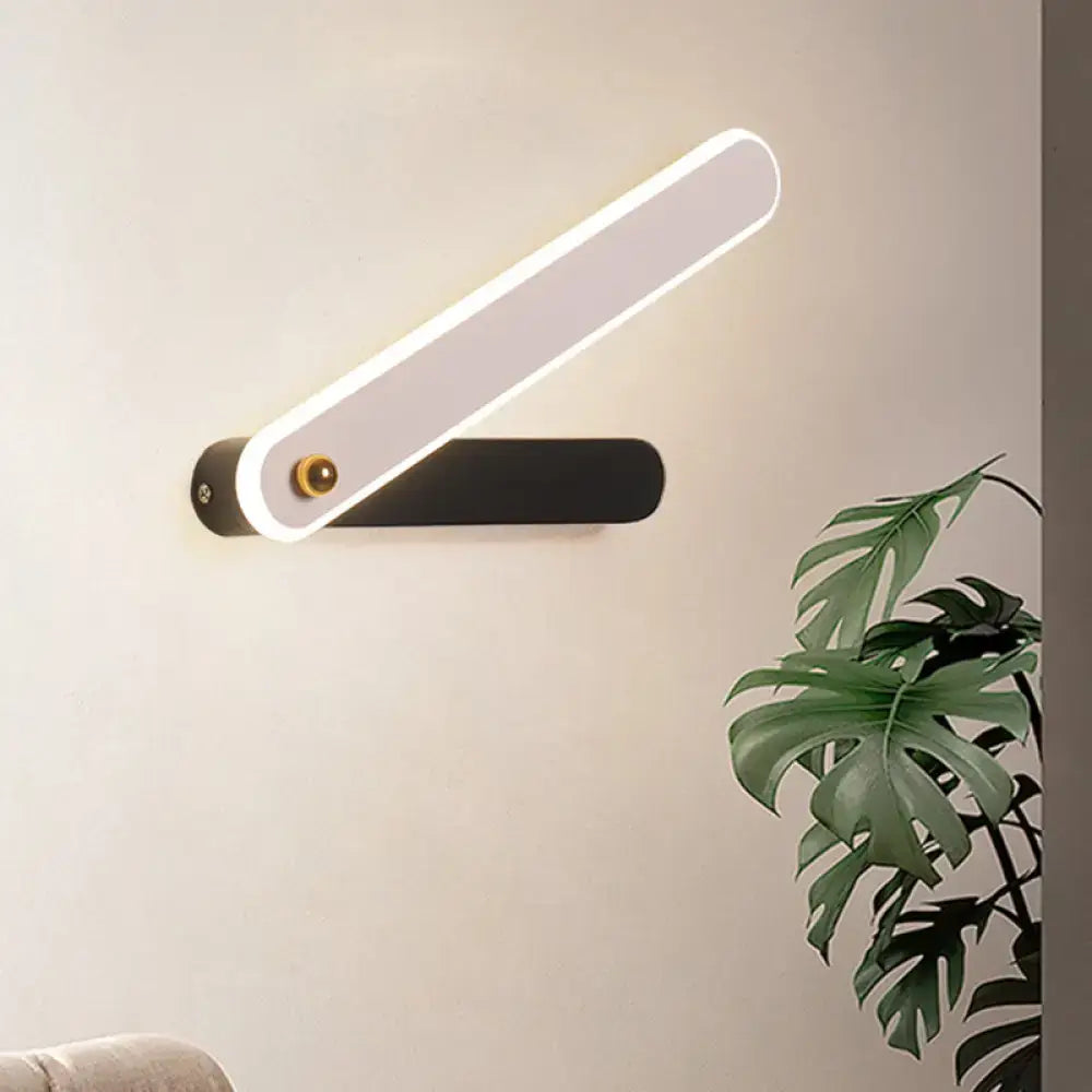 Modern black and white led wall mount fixture featuring a sleek illuminated rectangular light bar on a matte black base