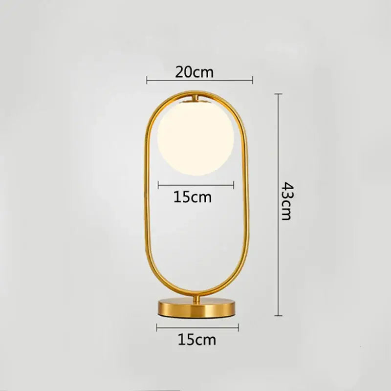 Modern brass glass led table lamp with gold-toned oval design and warm light for bedroom reading decorbites brass glass