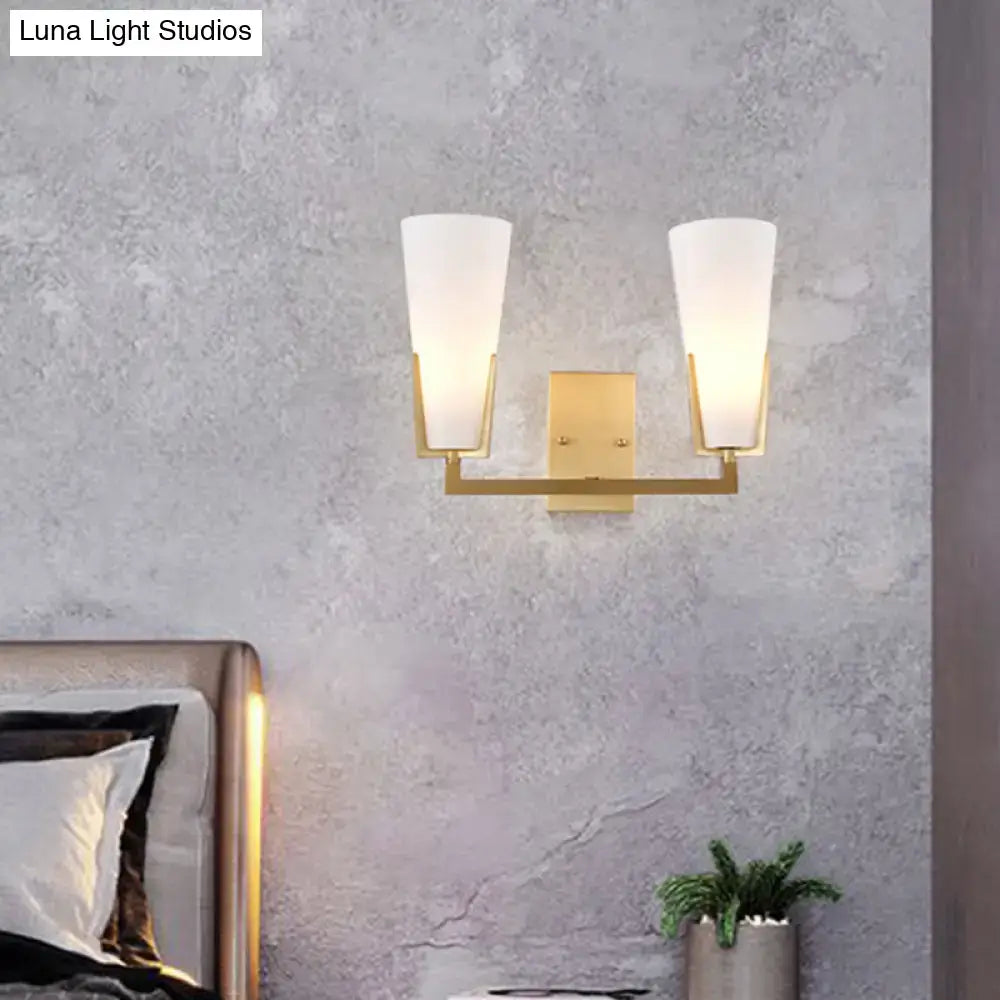 Modern brass led wall lamp with two white frosted glass shades suitable for 220v-240v and 110v-120v use