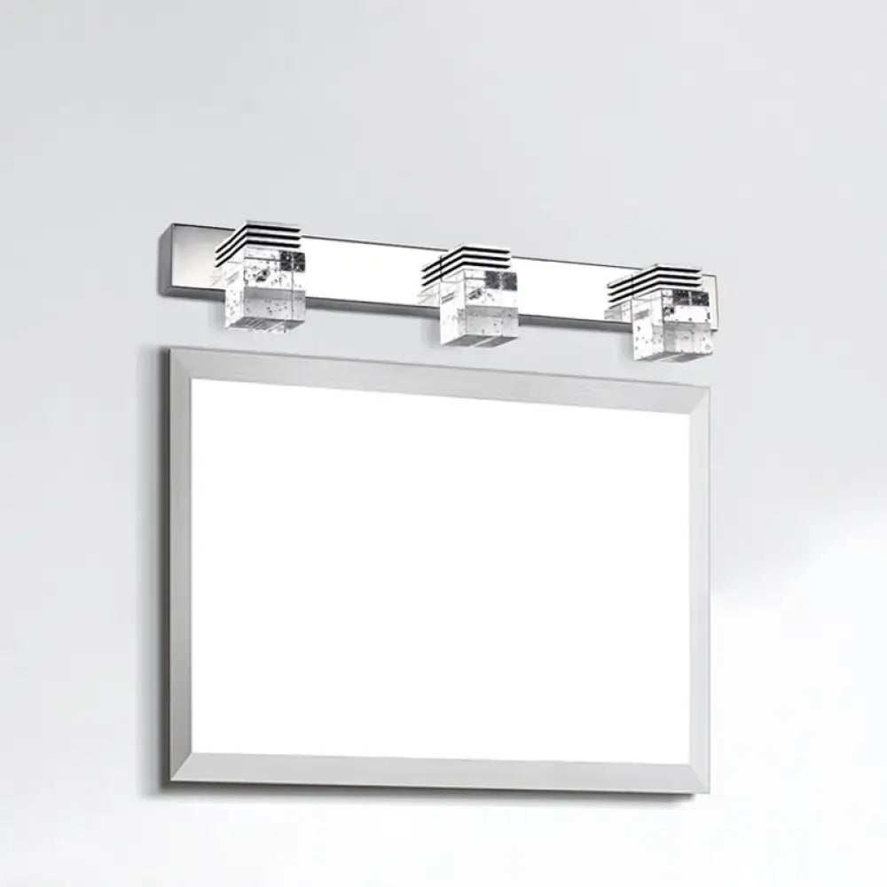 Modern chrome crystal vanity light fixture with three crystal-encased led fixtures for bathroom use