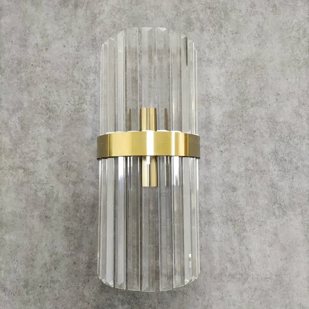 Modern crystal gold led wall lamp with clear glass fluted rods and polished gold-toned metal band for bedroom lighting