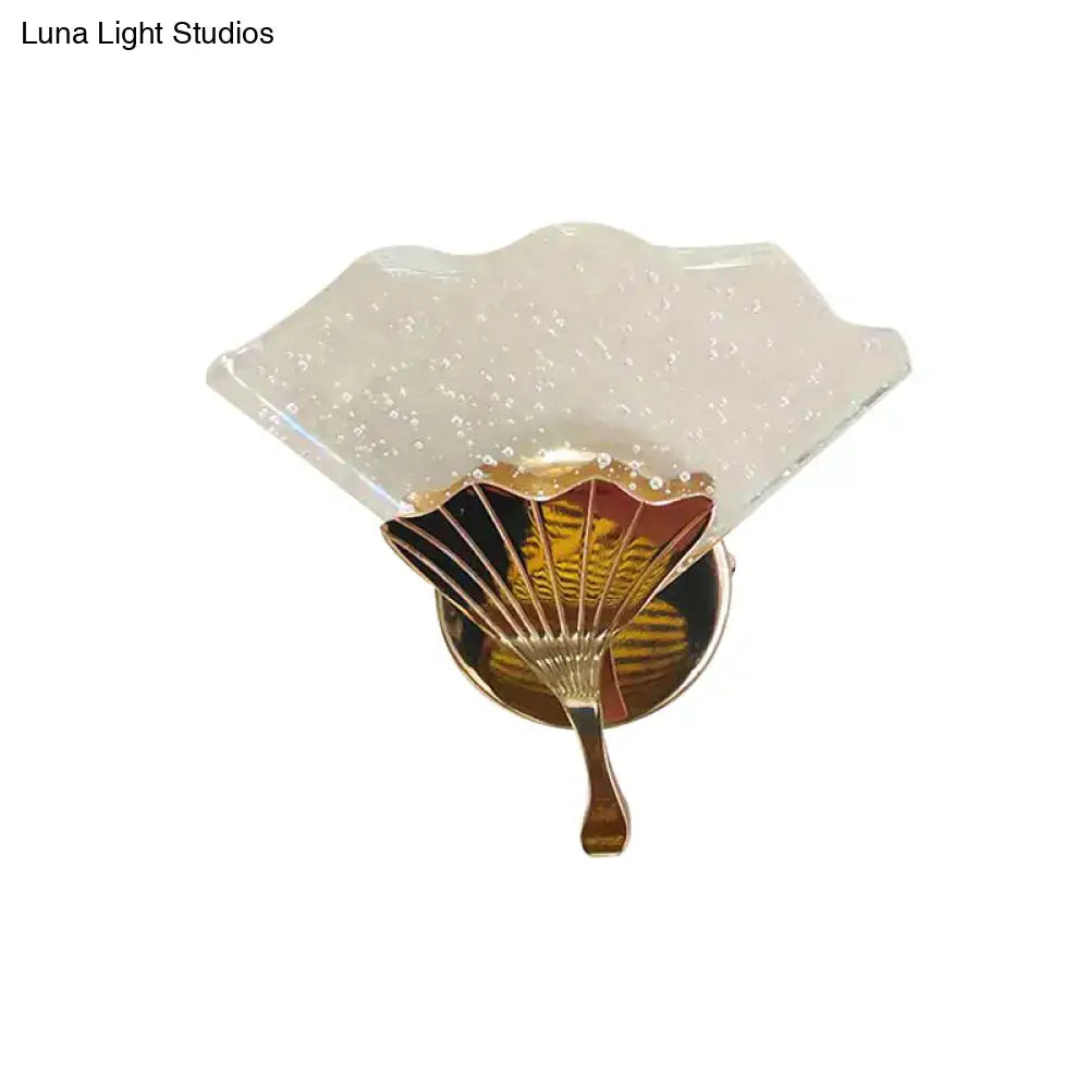 Modern fan gold led wall sconce lamp with translucent textured glass shade and ornate gold finished direct wired electric base