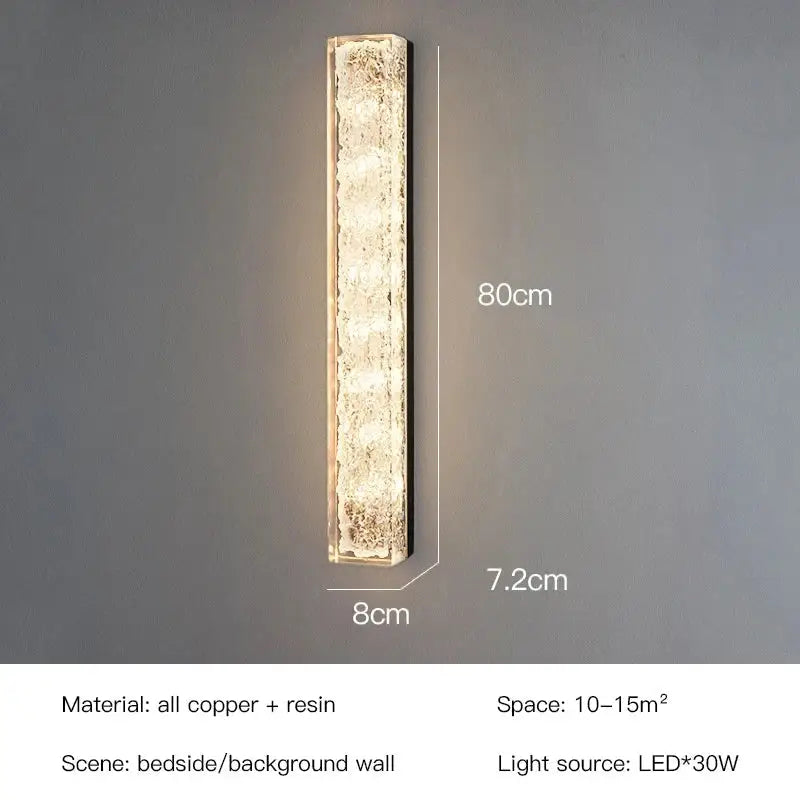 Modern gold and black led bedroom wall lamp with 80cm textured copper and resin finish emitting warm led light