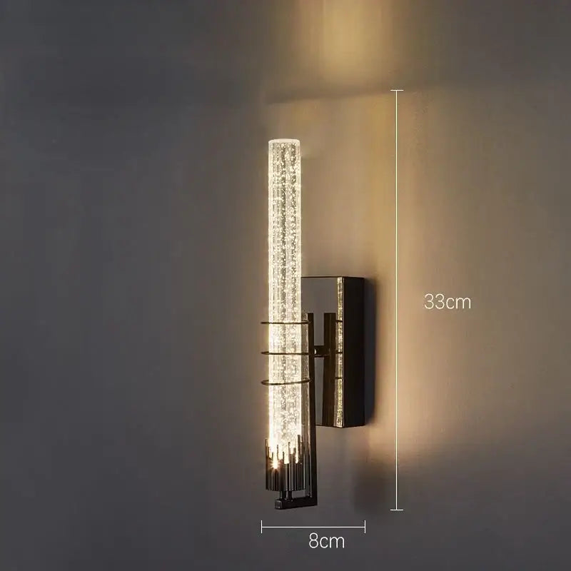 Modern gold and black wall sconce with textured clear glass cylinder and metallic frame for decorbites crystal led wall lighting