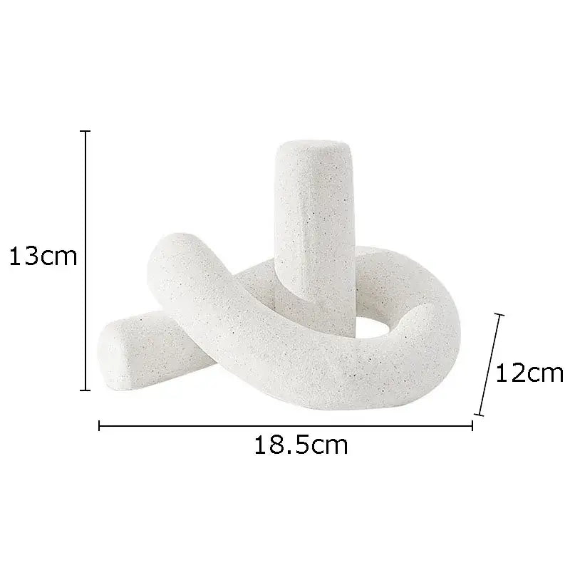 Modern gold decorbites ceramic knot sculpture featuring white speckled abstract interlocking cylindrical forms for decor