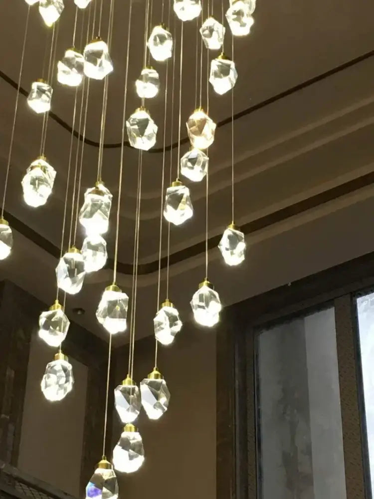 Modern gold elegant crystal chandelier with faceted clear glass pendants and gold-toned chains for living room decorbites elegant crystal