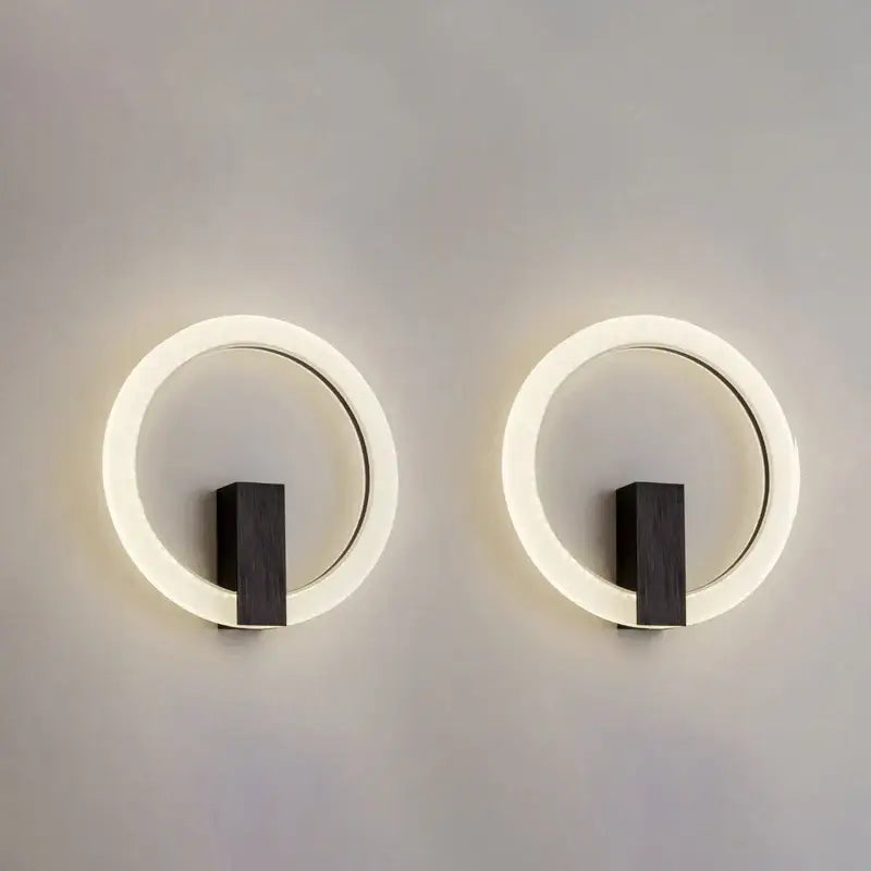 Modern gold geometric led ceiling light with circular led wall sconces featuring glowing white rings and wood base