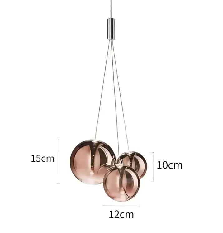 Modern copper-toned spherical pendant light with metallic finish and minimalist design for pendant chandelier use