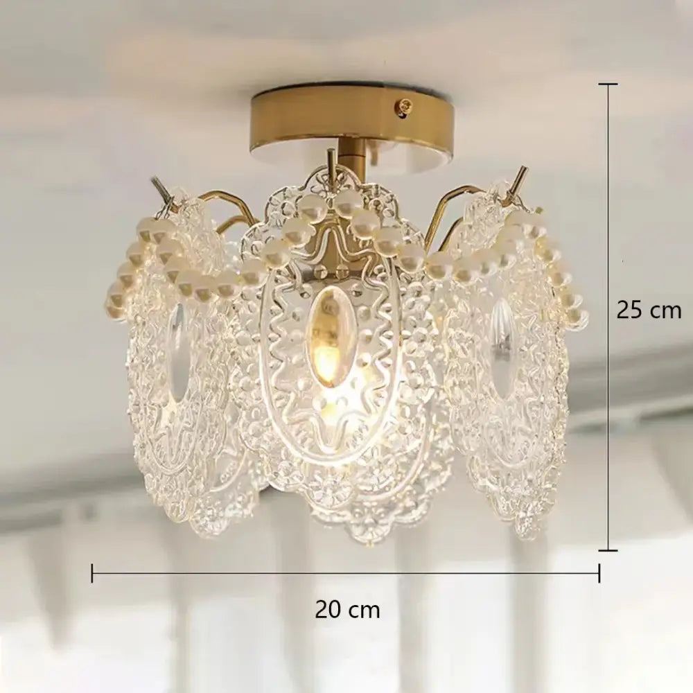 Modern gold glass shade ceiling light with gold metal base, clear glass lace, and white pearl strands chandelier