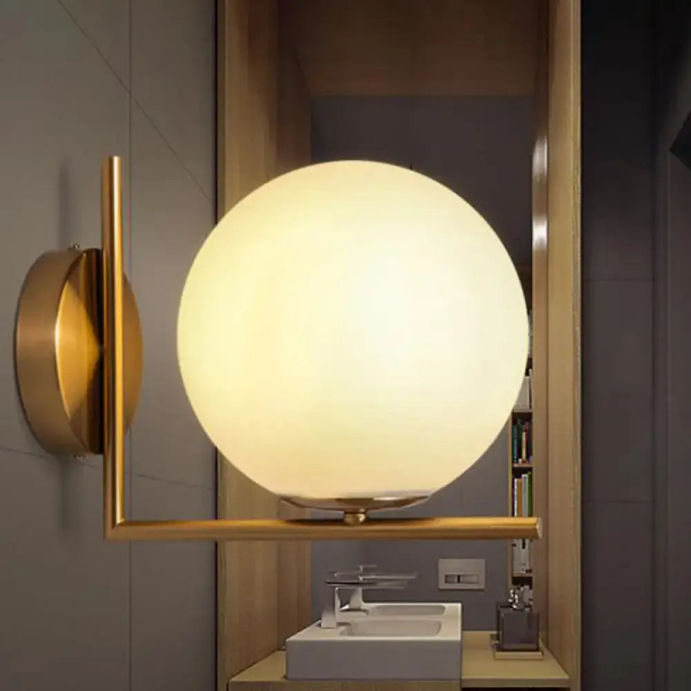 Modern gold globe shade wall sconce with opal glass globe and metal frame suitable for led incandescent fluorescent bulbs
